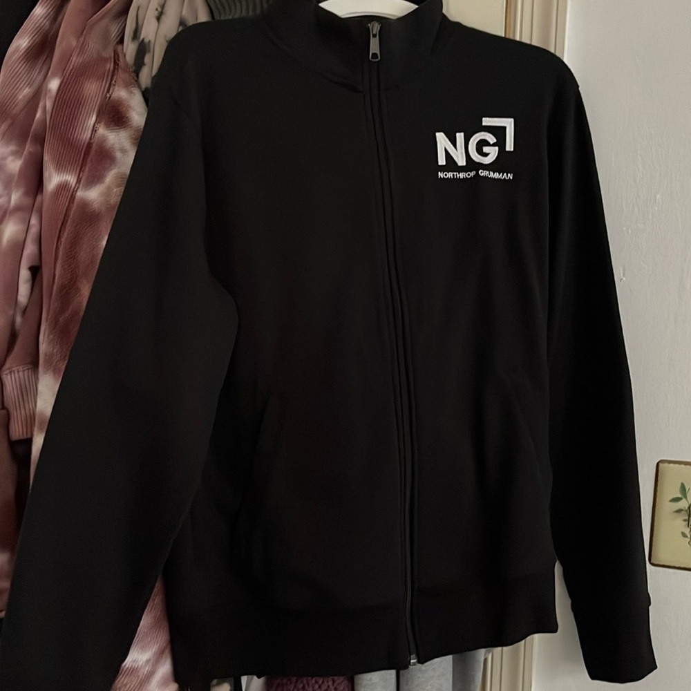 New without tags, never been worn. Northrop Grumman turtleneck zip jacket.